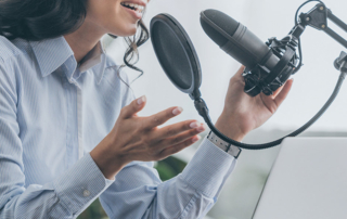 A person speaks into a microphone